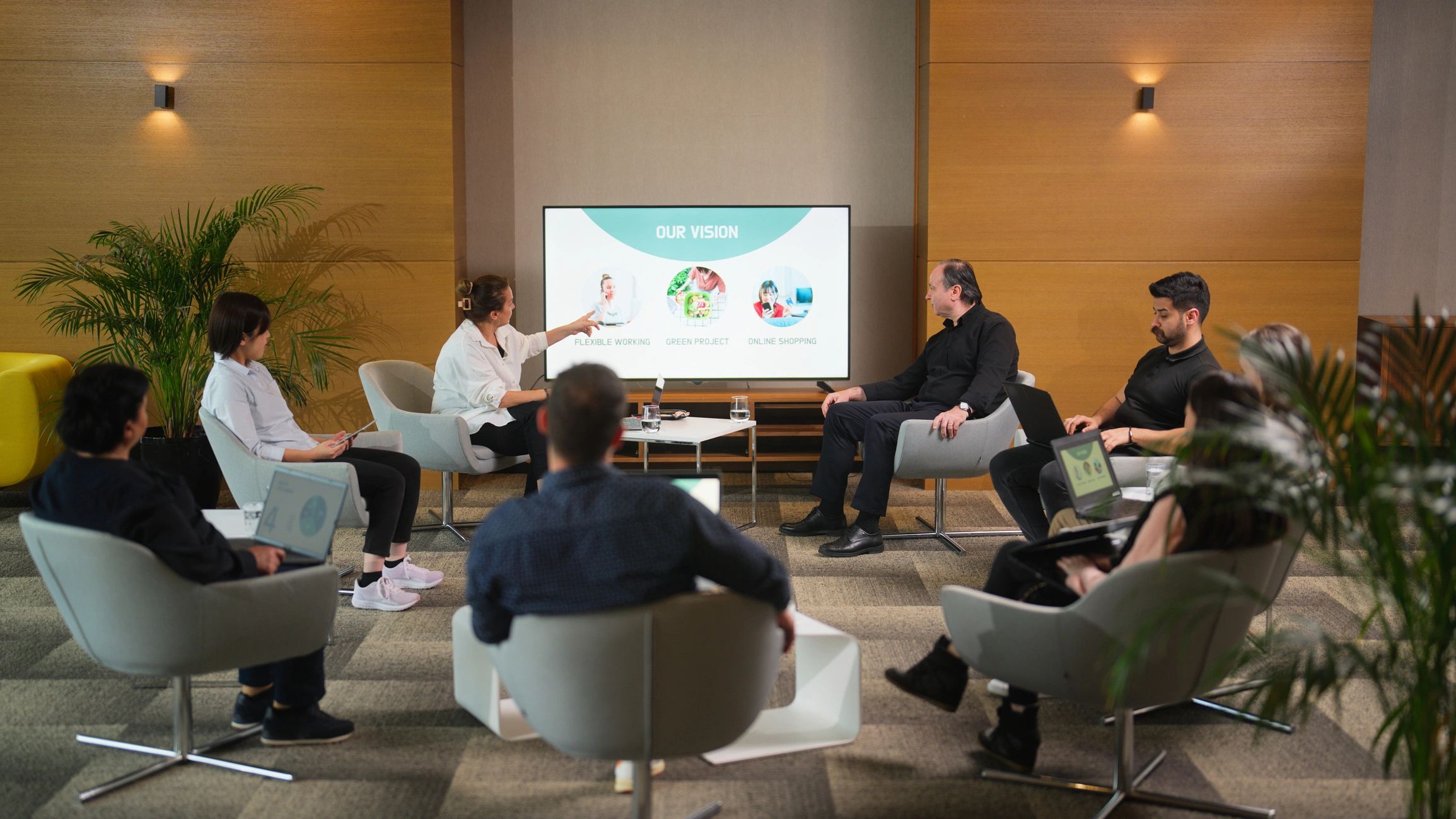 Group of business people gathering for a technology workshop