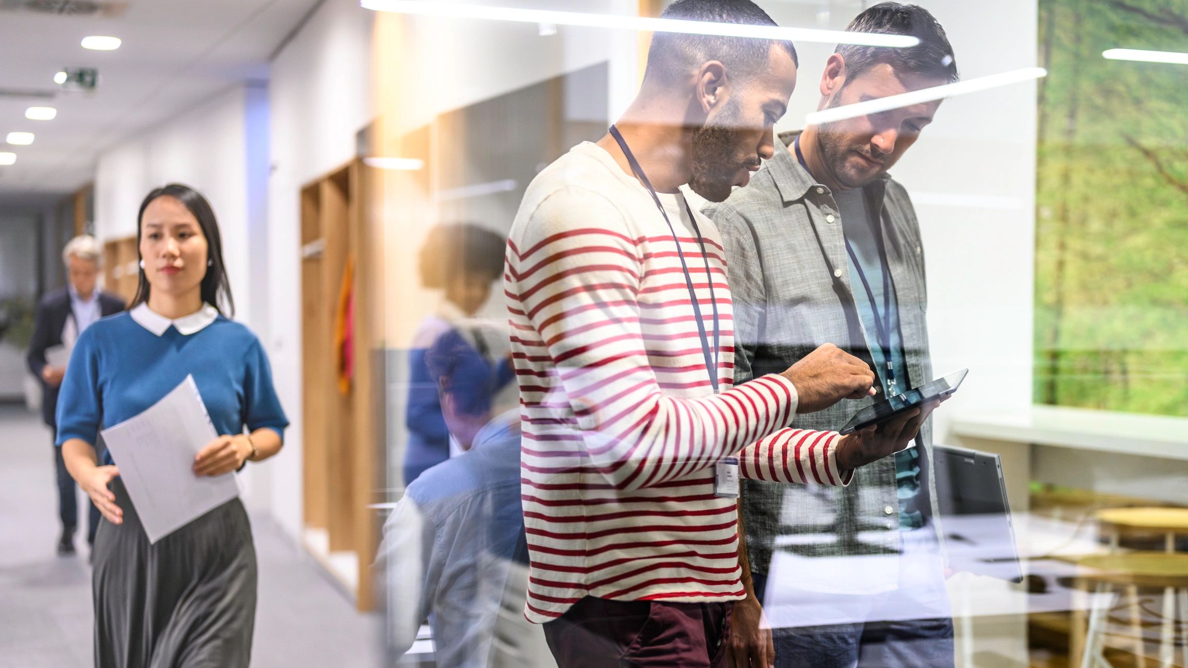 South African professionals walking and talking in a modern office
