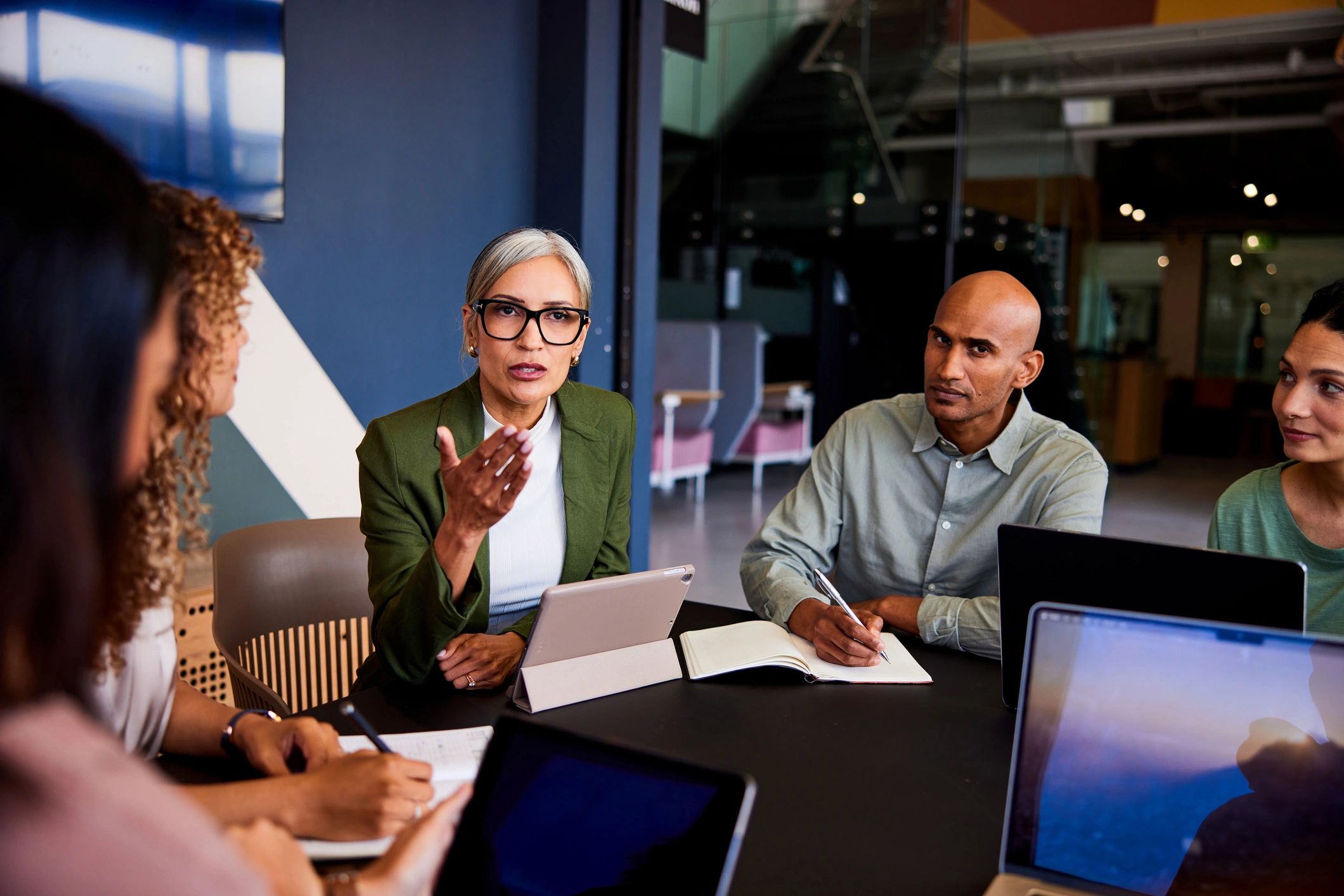 South African business leader guiding a team discussion
