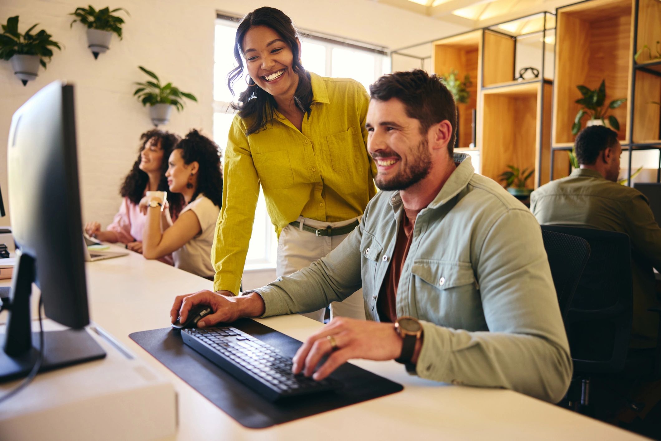 South African colleagues working together at a computer